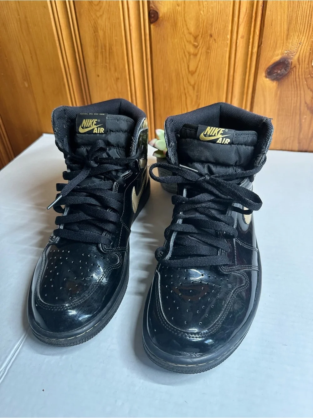 Nike Air High-Top Sneakers in Black with Gold Logo